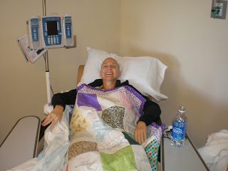 Smiling patient resting in hospital bed