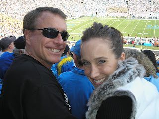Smiling couple at football stadium