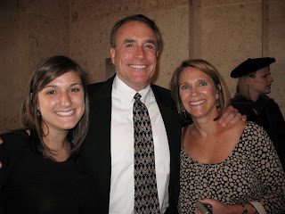 Man in suit with two smiling women