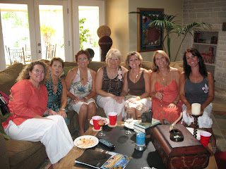 Women gathered on couch with drinks