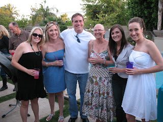 Group of friends posing outdoors with drinks