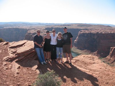 Five people on red rock canyon overlook