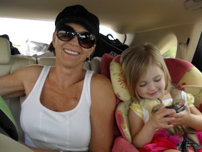 Smiling woman and child in backseat