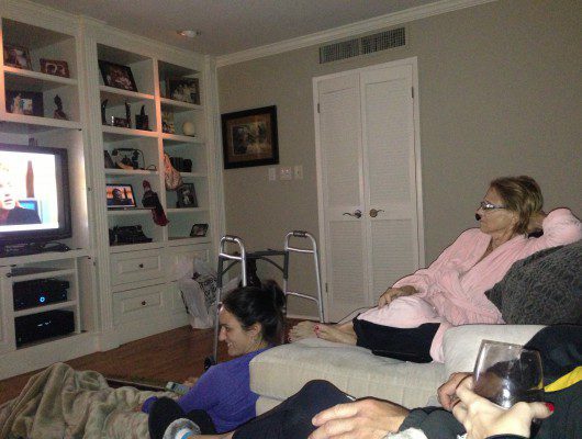 People relaxing and watching TV together.