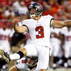 Football player kicking during a game.