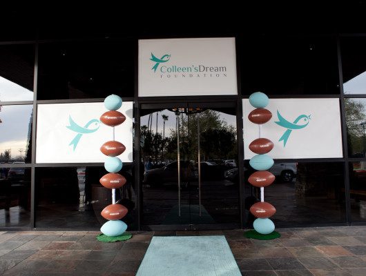 Entrance with football-themed balloon decorations.