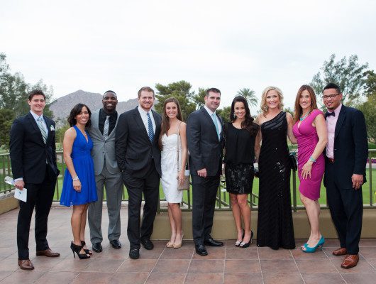 Group of people dressed in formal attire.