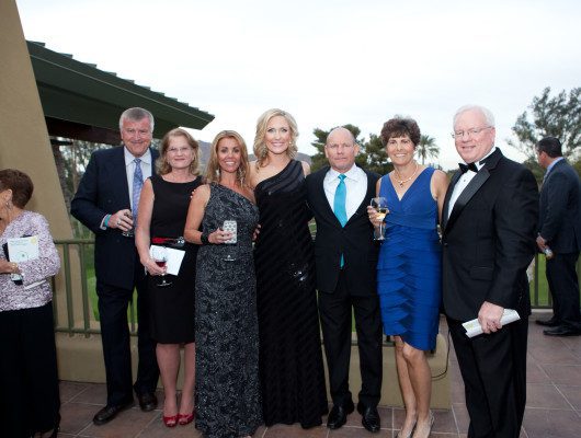 Group of people dressed for a formal event.