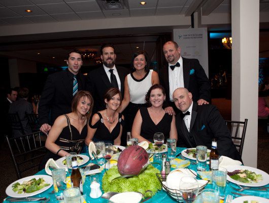 Group dining at a formal event table.