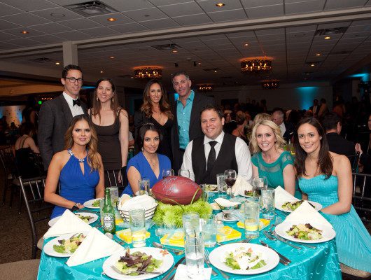 Group dining at a formal event table.