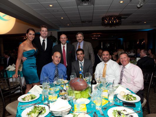 Group of people at a formal dinner.