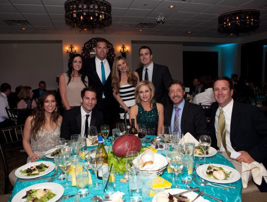 Group of people at a formal dinner.