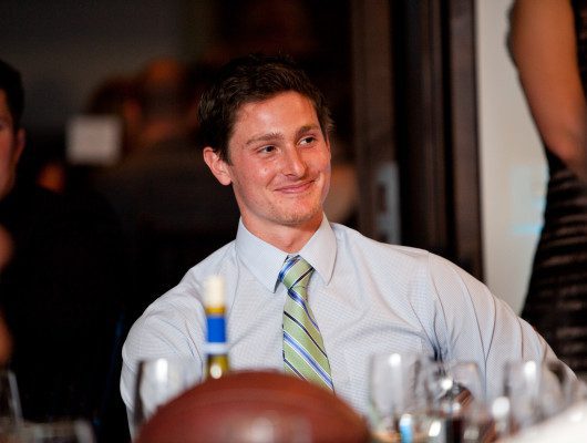 Smiling man at a formal event.