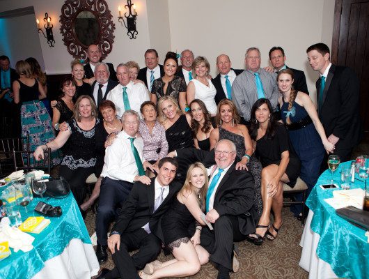 Group of people at formal indoor event.