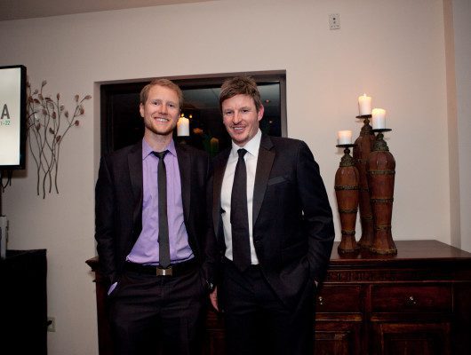 Two men in suits at an event.