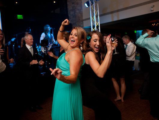 People dancing joyfully at a lively party.