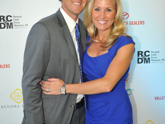 Couple posing at a formal event.