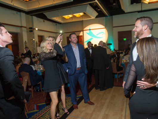 People socializing at a formal event.