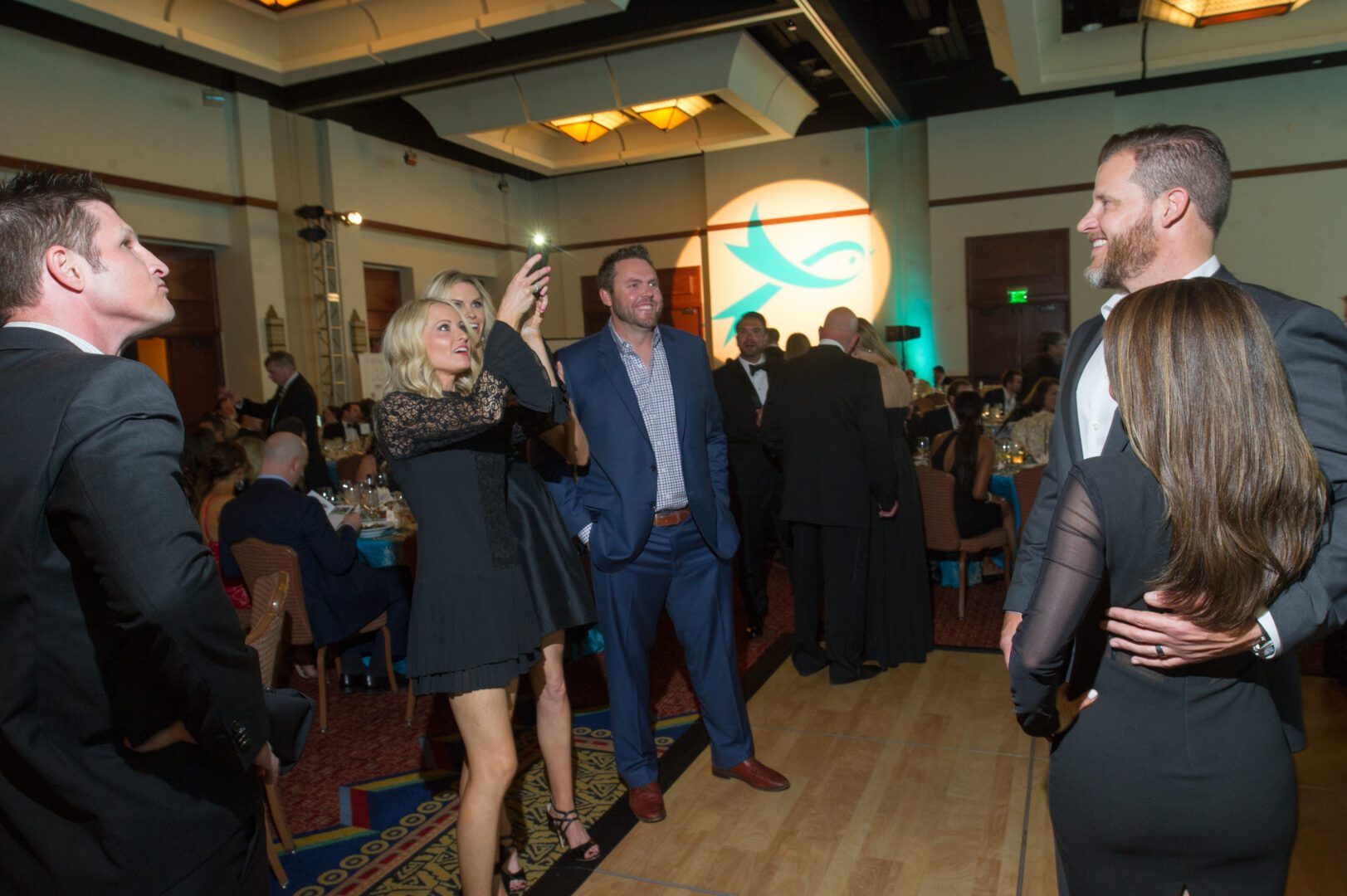 People socializing at a formal event.