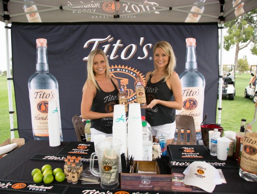 Two women at a Tito's Vodka booth.