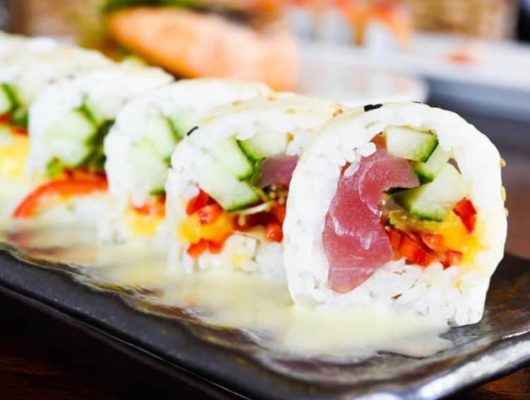 Sushi rolls with tuna and vegetables.